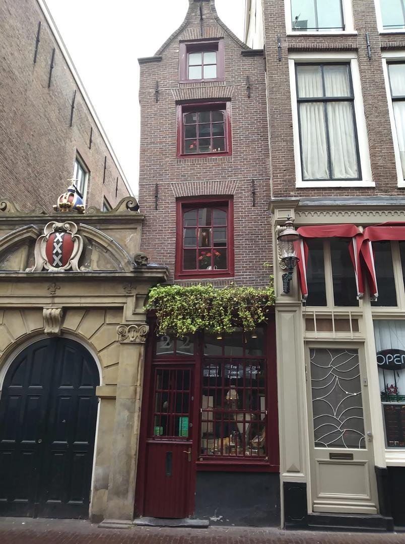 Supposedly this is the skinniest house in Amsterdam. It was built for the servant of a rich guy when the servant said if he had a house 1/10th the size of the rich guy's, he'd be happy. So the rich guy built it for him. (It