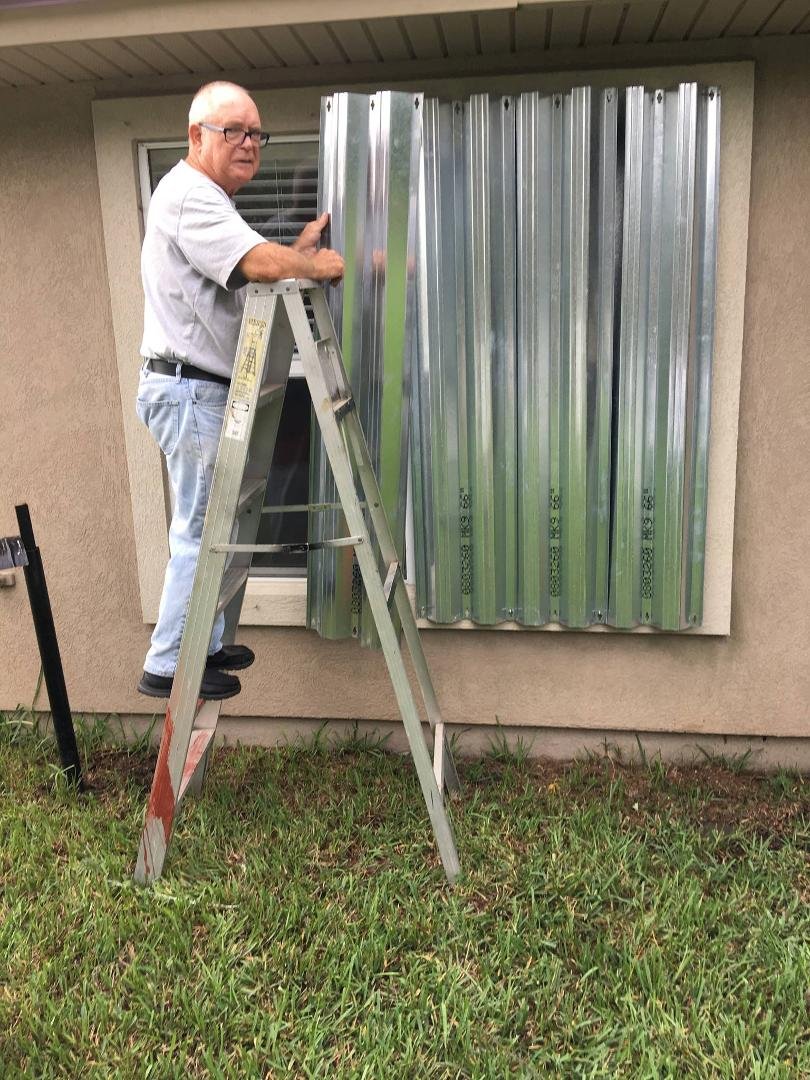 Hurricane shutters coming down---Great! Still no power---not so great! So dark inside last night that the cat fell off the bed twice!