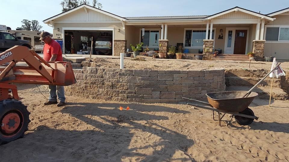 Putting the last few blocks on the first section of wall. Both of us sore in places we didn't know we had and exhausted.