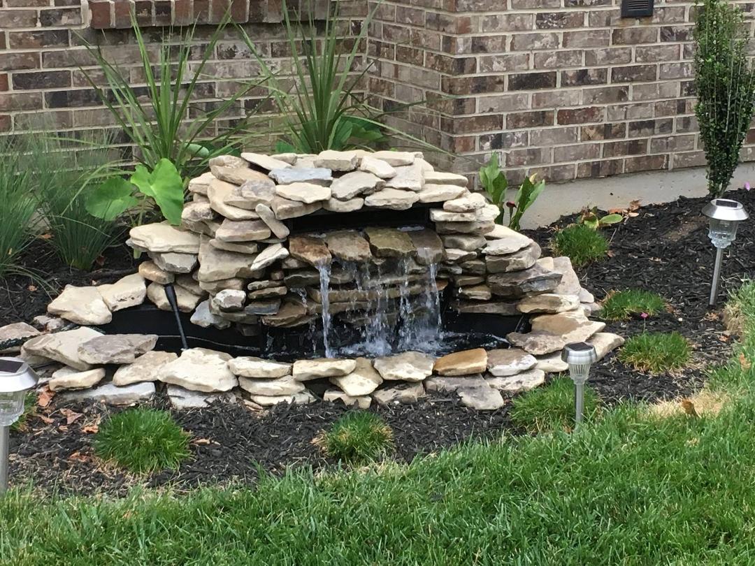 Redid the waterfall to make it look more grotto.