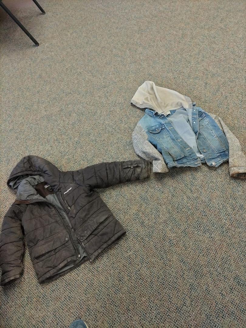 Found 2 kids jackets on bench in front of Senior Center.