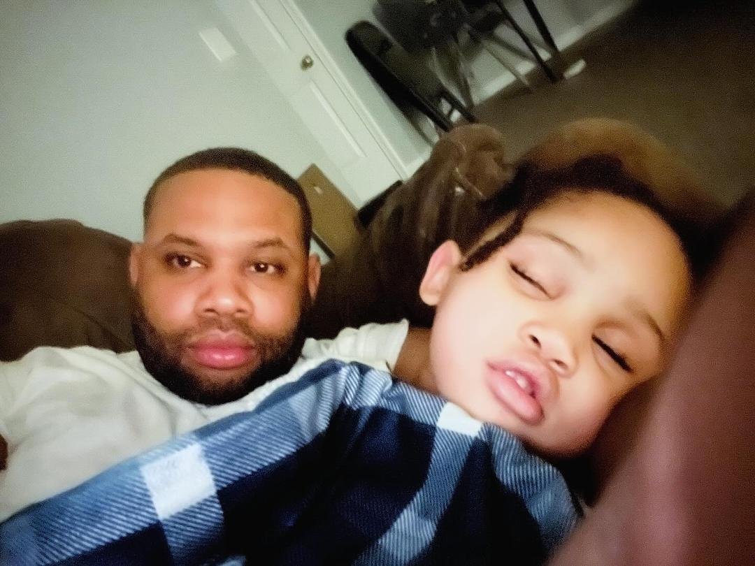 Trying to do homework, However Izzy wants to sleep in her daddy’s arms. precious moments you never get back when there gone.