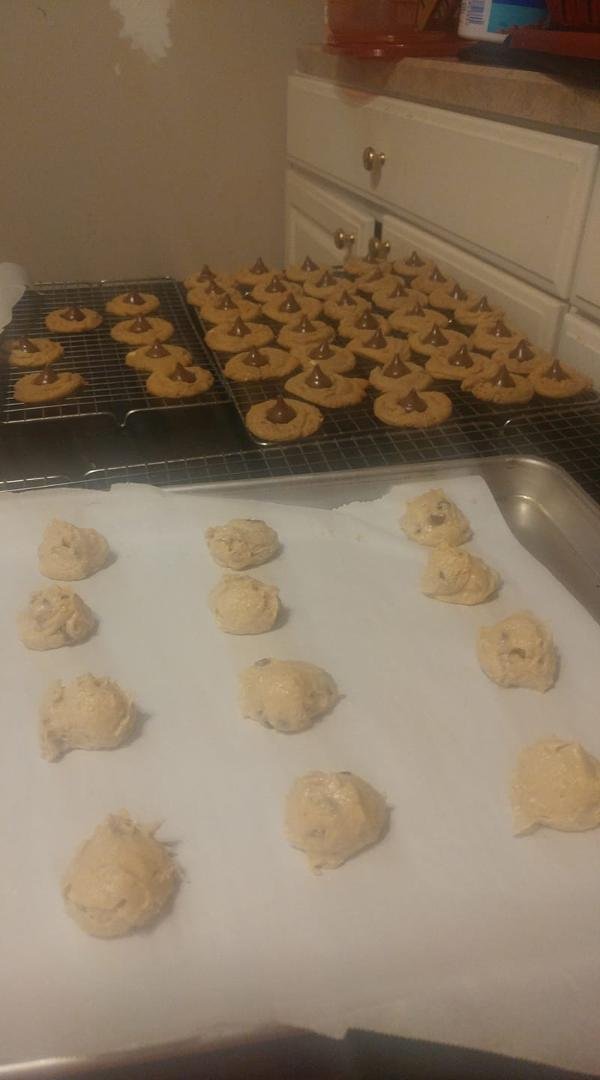 Well its that time of year again. Christmas cookie baking time. Peanut kiss blossoms working . next up chocolate chip... more in the frig chilling..snickerdoodle, oatmeal raisin, Russian tea cake, sugar cakes, molasses wai