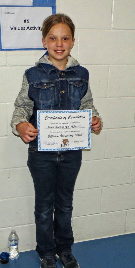 The proud graduate with her certificate.