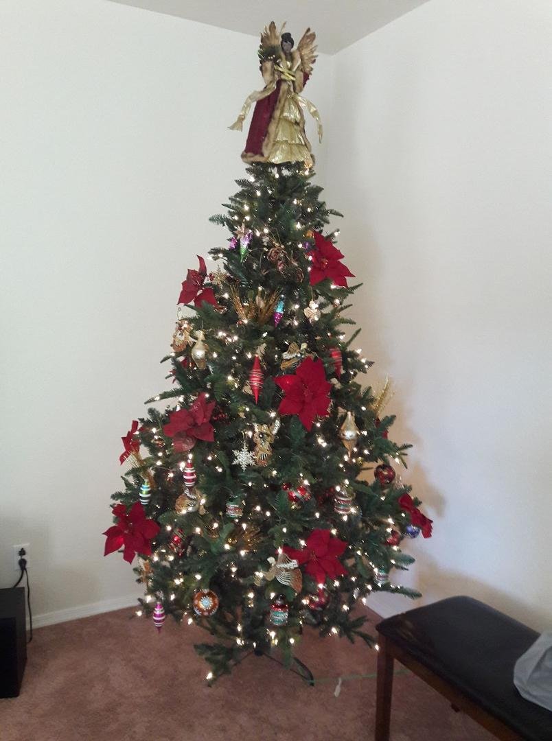 Our tree this year. If only I can get the angel to stay put lol