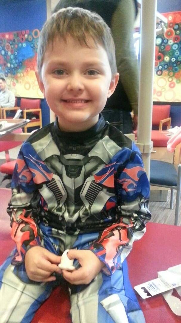 Oldest great grandson.  Wouldn't wear his mask but why cover up that cute face on Halloween.