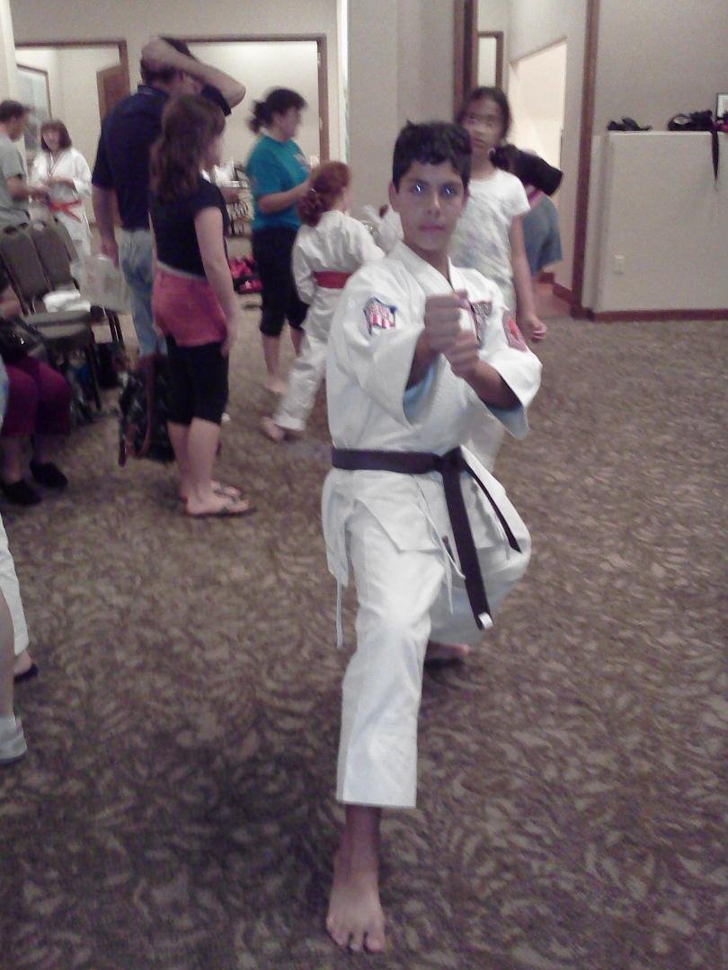 Tonight my son Vincent "Bubba" crossed over to Shuri Ryu Okinawan karate. His instructors Mark and Venita Knighton of Anari Martial Arts Center awarded him green belt wich is the equivilent belt rank as he had in American K