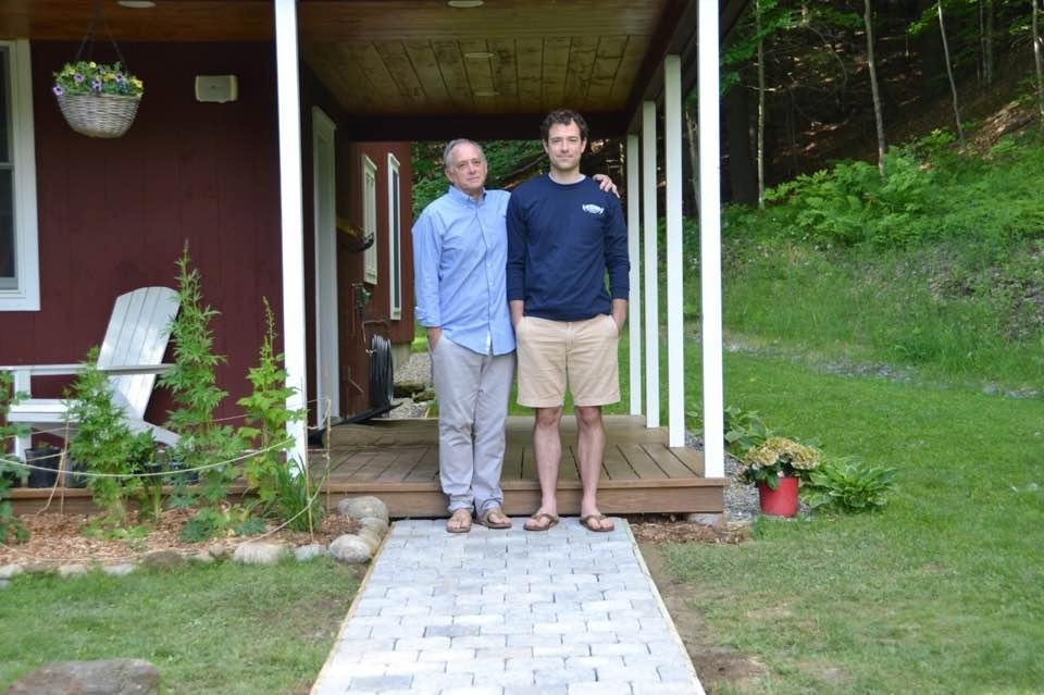 Father and son install new front sidewalk in Vermont.
