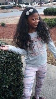 This is our great-granddaughter with a big smile