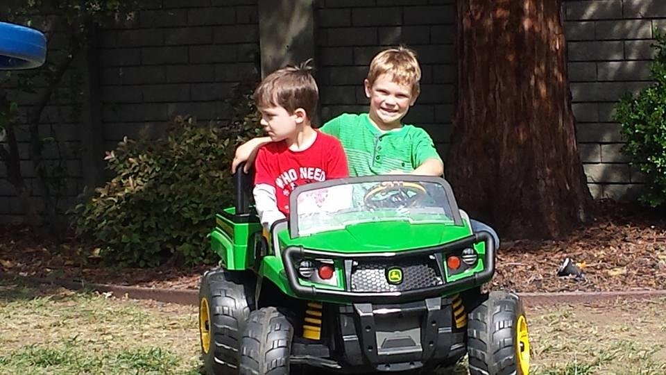 Brandon and Ryan out for a drive in the John Deere.