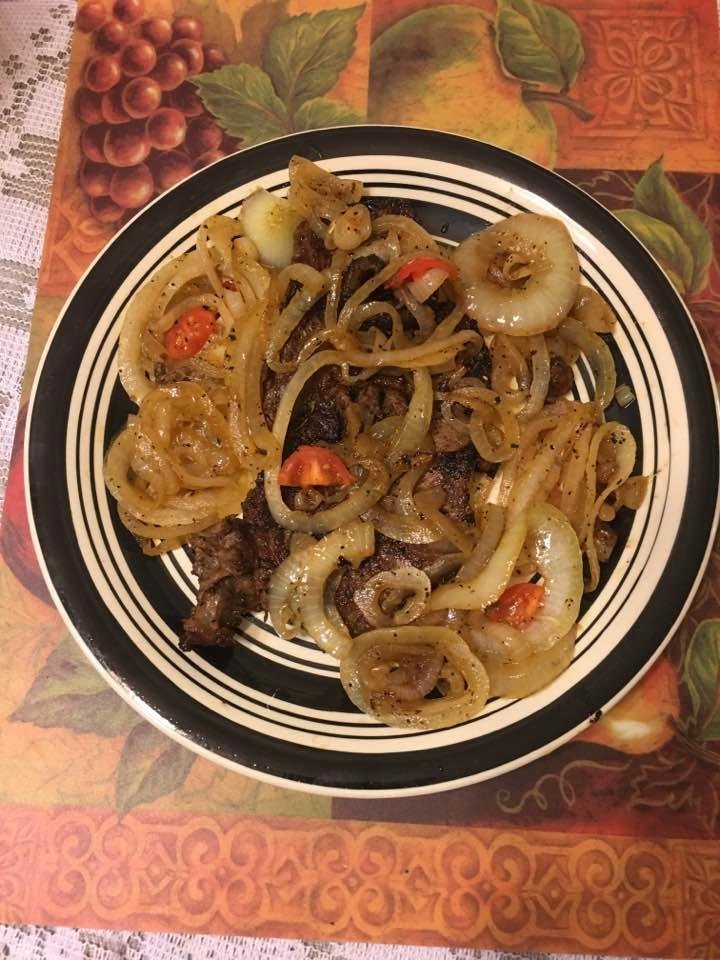Our supper tonite! Steak, smothered with carmalized onions, cherry tomato pieces, & Wayne's "Special" Seasoning! Delicious!