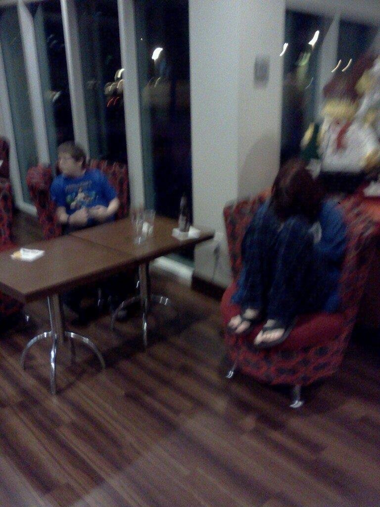 Aubz hiding her face and Jay at the playhouse and bar