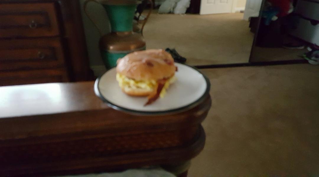 New sweet breakfast sandwich, fluffy eggs, bacon between jelly donut halfs. You won't go back.