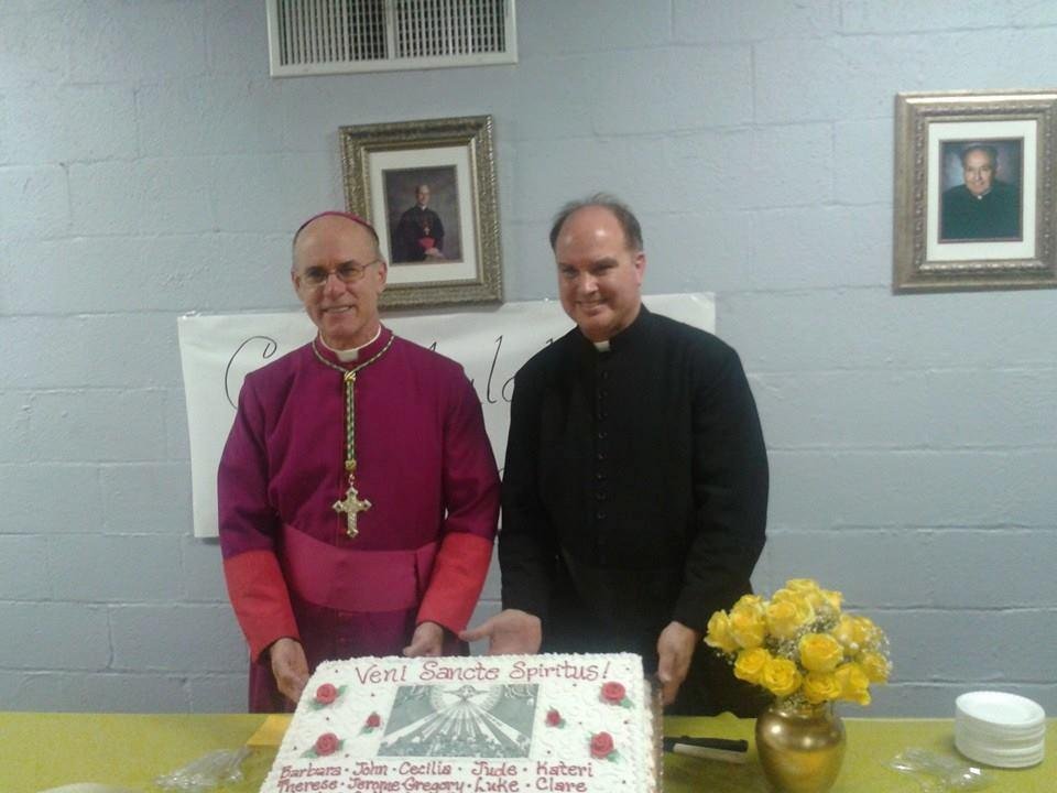 Bishop Rhoades and Father Gabet at Sacred Heart in Fort Wayne at the reception with the confirmandi.