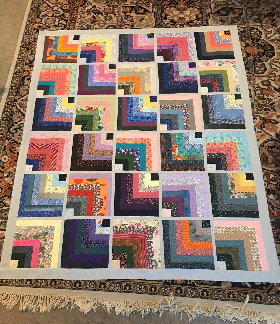 Another way to spend a couple of snow days, Mary cuts designs, and Darryl sews.