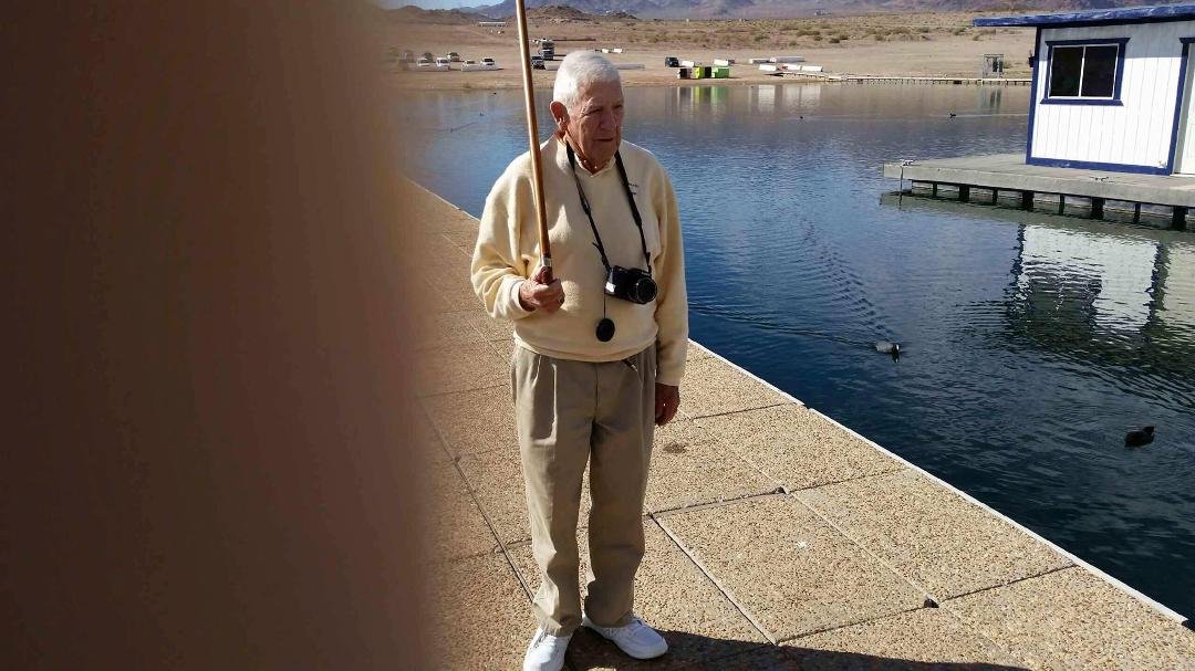 George my brother standing at attention holding my cane at Lake Mead Nevada........Bob Huston Sr.
