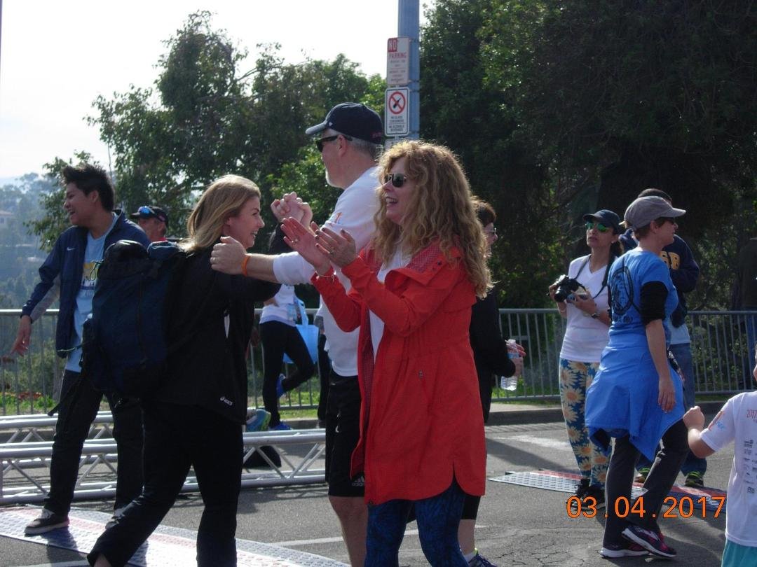 Brett & Kelly King greeting runners at the Finish line at the Finish Chelsea's Run 5K at Balboa Park