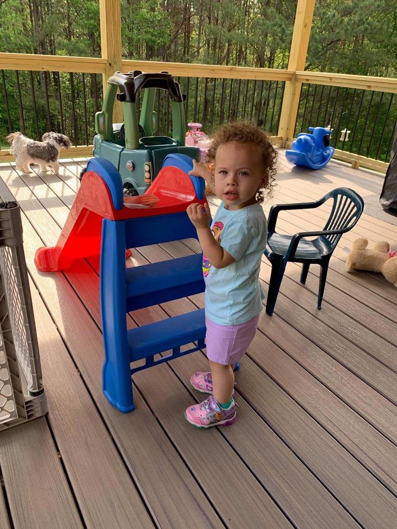 Scooter playing on her slide