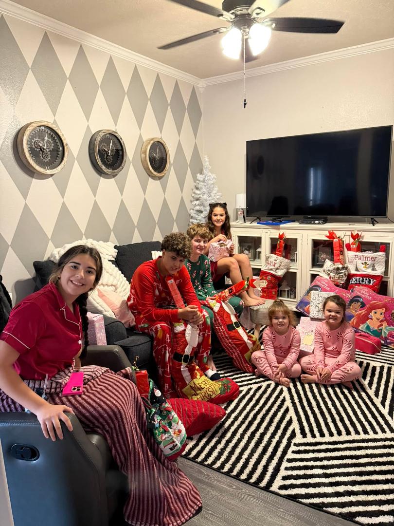 Children waiting for the magic word to start opening presents !  Go !