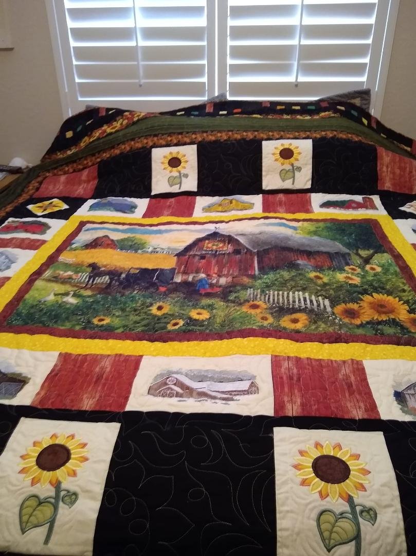 Finally a quilt for me barns and sunflowers California King designed and quilted by me and long-armed by Barbara Pasternak