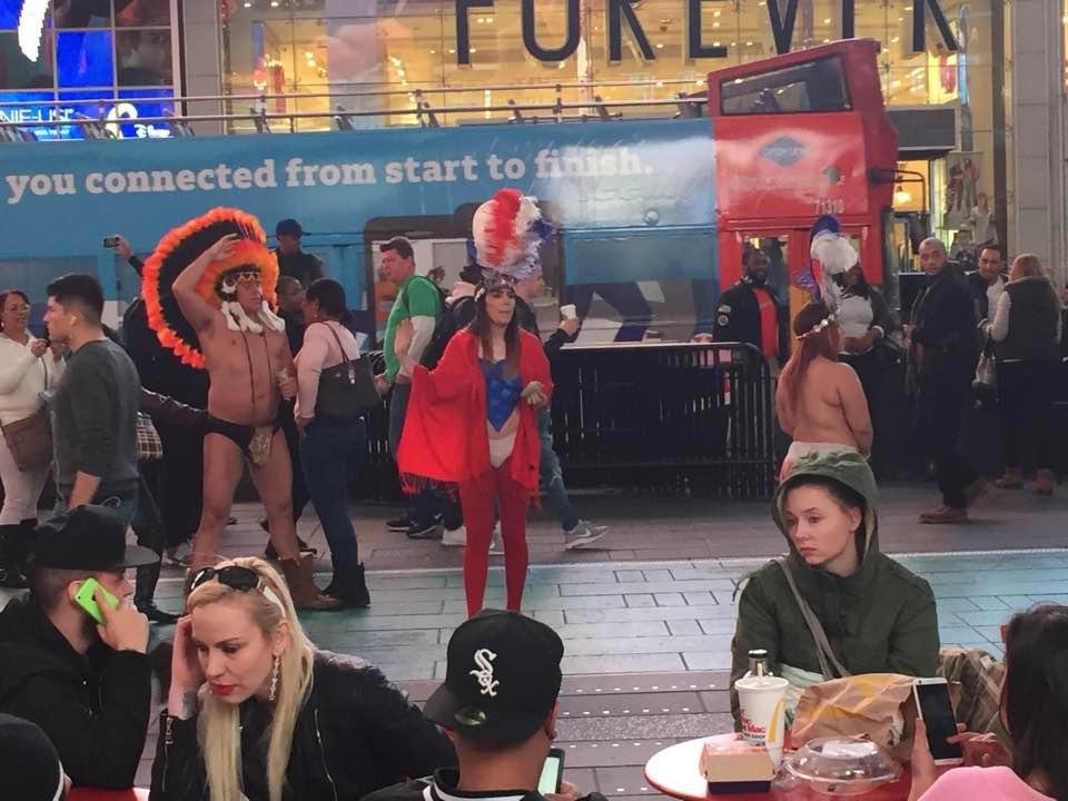 The Naked Indian Chief posing. The women, I have no idea what's going on. Some of their "costume" may be painted on. Life in Times Square.