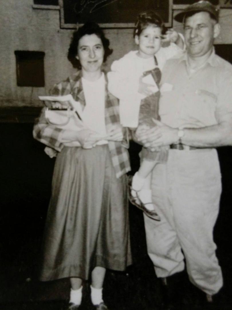 My dad holding me in his arms, still wearing his work boots from working at the dairy. Happy Father's Day in heaven, Dad.