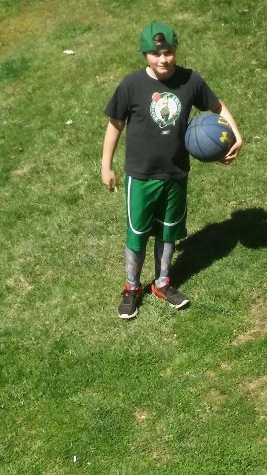 My handsome grandson Ethan with celtics hat, shirt and yes those are Larry Bird Knee high celtics socks he has on...Can we say handsome ....My daughter just sent me this picture as this is how he came outside to play B-Ball