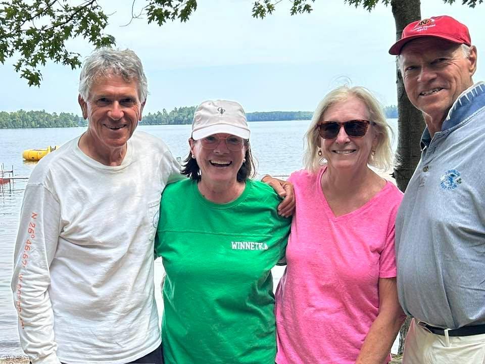 Hockey parent friendships last a looong time! Vince and Barb Aquilino, visiting a Burke family favorite camp-Red Arrow Camp, Woodruff, Wisc. RAC friends, you can see the yellow ‘island’ in the background.