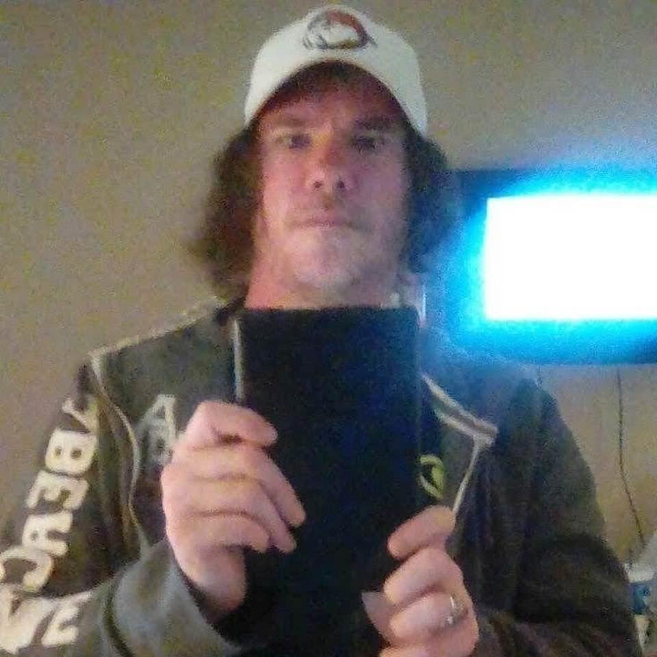 Playing with my kindle in my room at the house