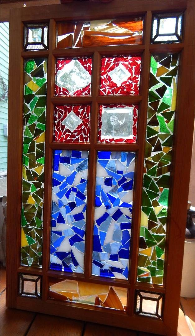 Corner pieces were salvaged from a broken lamp. center red sections are beveled glass pieces.
All was covered with acrylic resin. This is one of my current ways I like to cover the pieces instead of using grout.