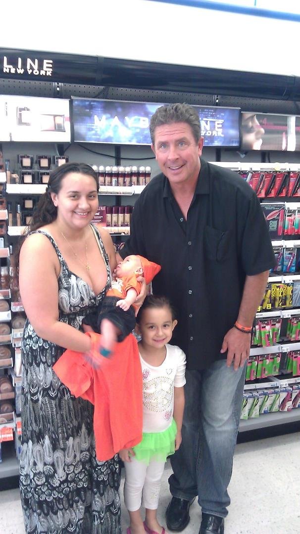 My Daughter Erica met this man in the pic and gave me an Autographed Cap for Fathers Day.