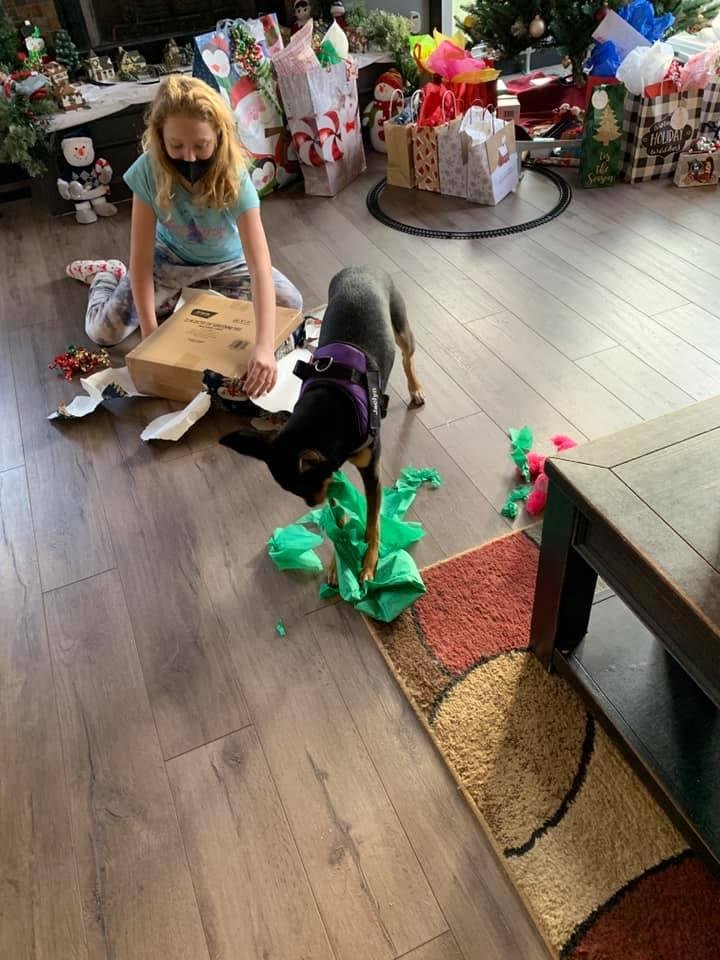 Jackie opening her Christmas present! Emma is opening Chase’s gift! (Chase is her cat)