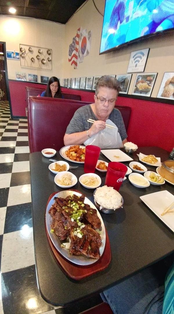 Linda Arbon Phillips enjoying Korean food.
