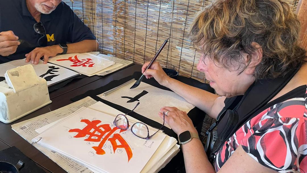 Renee works on her calligraphy skills.