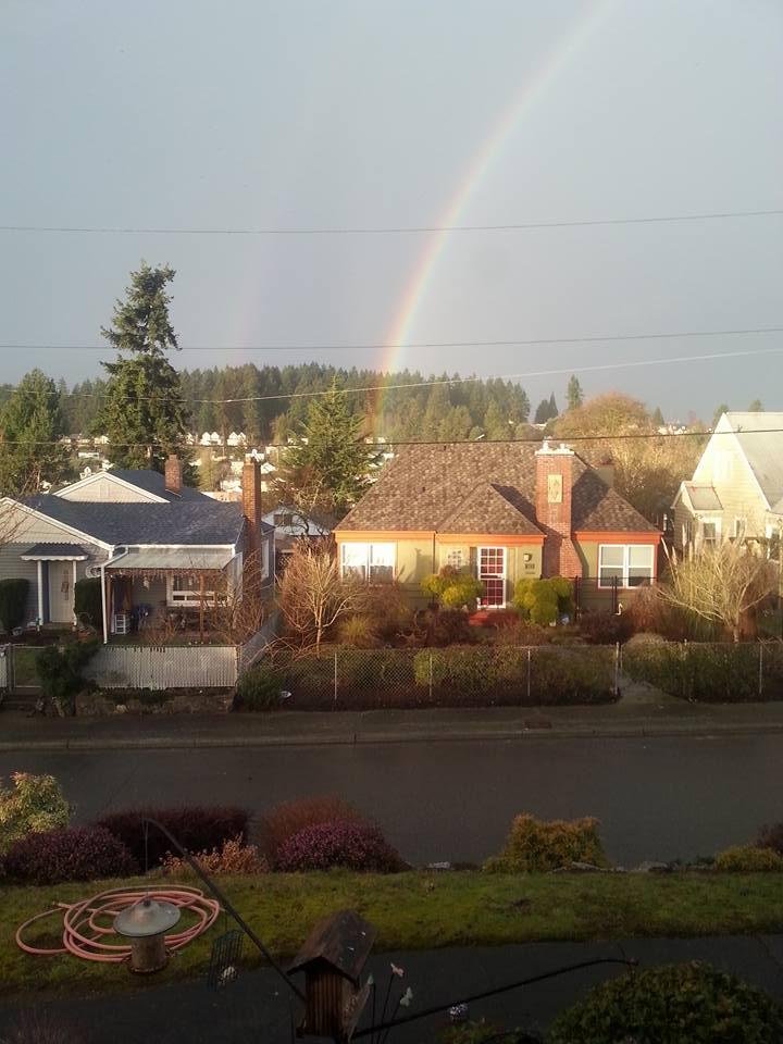 This is out my kitchen window this morning. It wasn't until after I snapped the pic I realized it's a double rainbow!