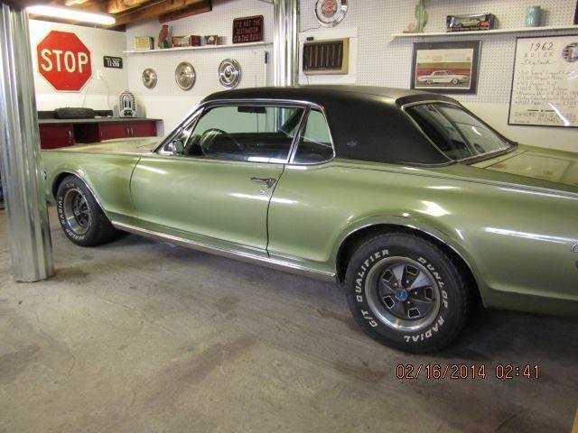 Cougar now in its spot in the man-cave! Plan on Racedeck flooring for that side only, and they are having an 8 hr sale tomorrow for Presidents Day - anxious to see how much off the usual 3.49/sq ft (yikes) is discounted!
