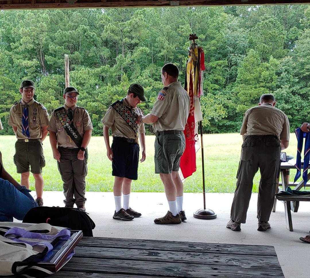 My Eagle Scout pinning Eagle wings on his Eagle Scout.