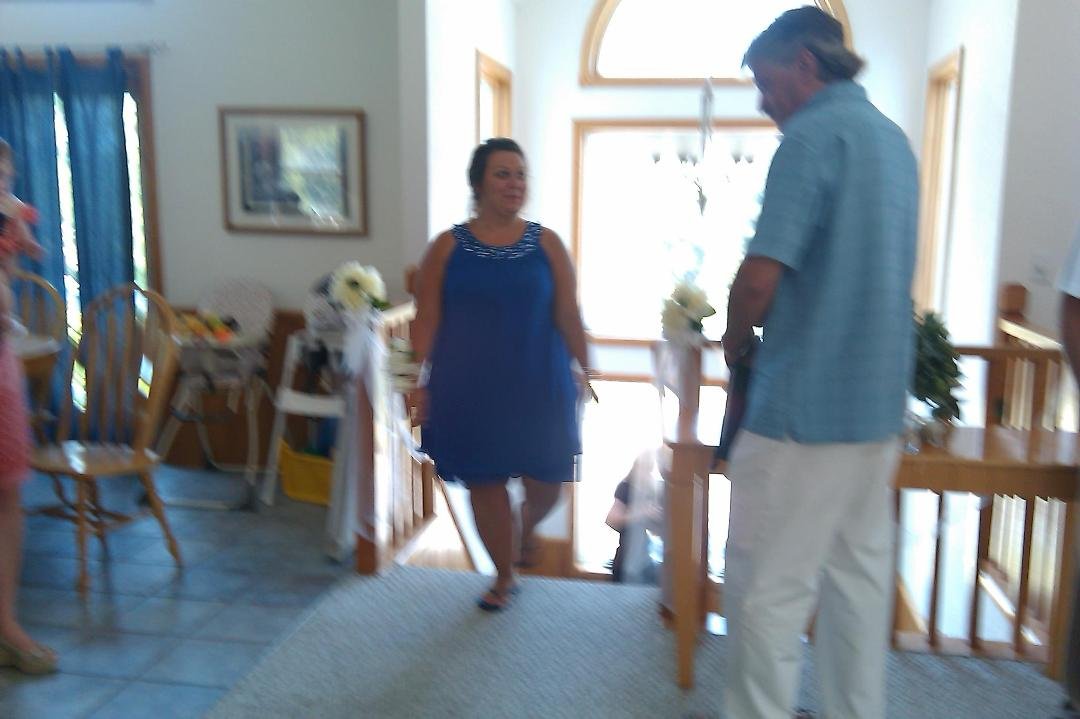 Missy the Matron of Honor coming up the stairs for wedding ceremony