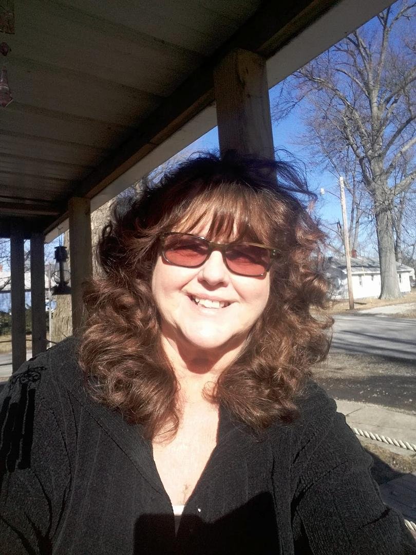 A sunny day in my hometown ....enjoying the birds and the squirrels on my front porch. Keep a happy heart***