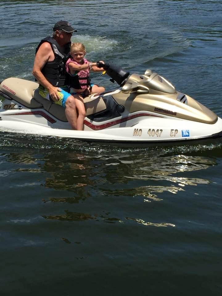 Mila & her Papa jet skiing.