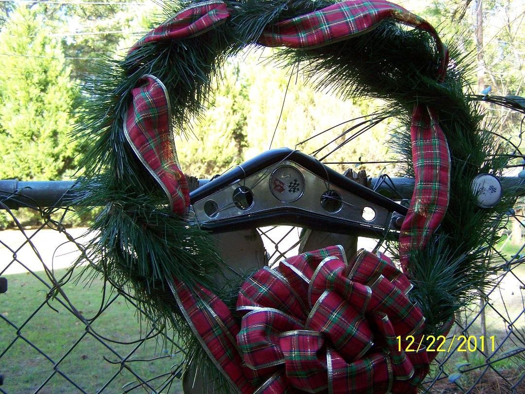 Redneck Christmas Wreath
This is the original steering wheel from the '60 Impala Jerry is rebuilding, and it was his idea to turn it into a wreath, not mine! lol