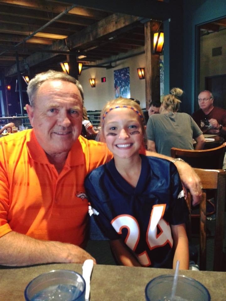 Madelaine and her grandpa at Brooklyn's before the Bronco game.