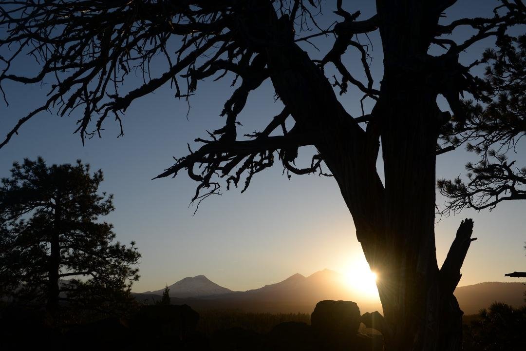 Eagle Rock Sisters OR.  Three Sisters at sunset.
