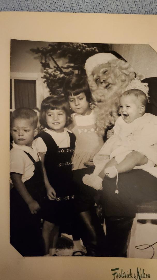 Somebody saw something and little Jude thought it was pretty amusing. 1957.
What a great Santa!
