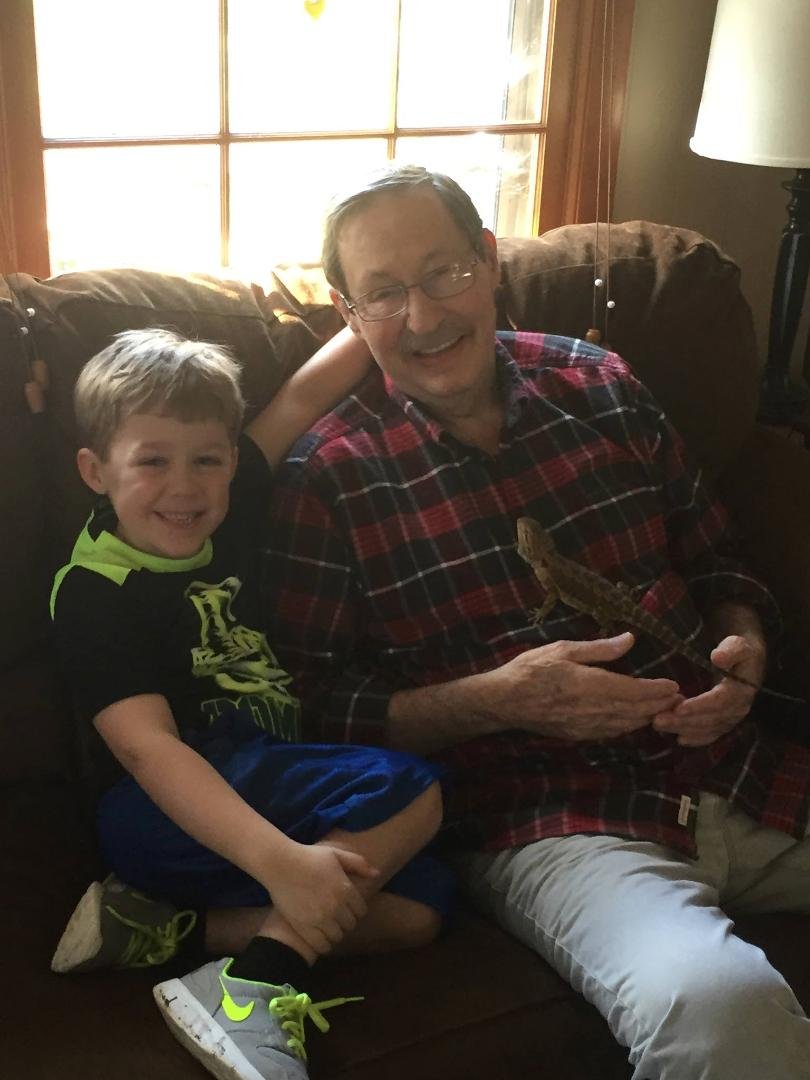 Papa Brady meeting "Spike", grandson's bearded dragon lizard.