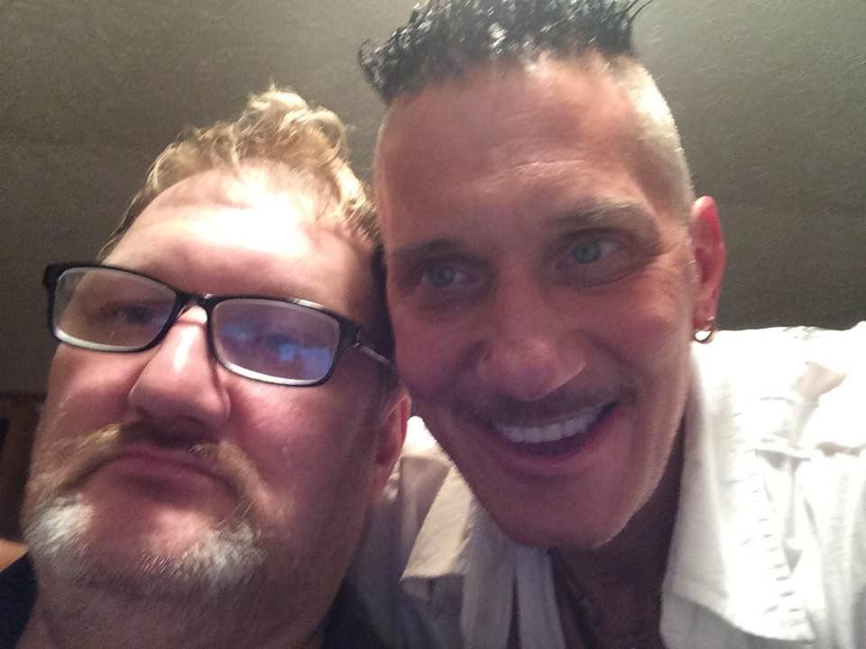 My younger brother and I at his house