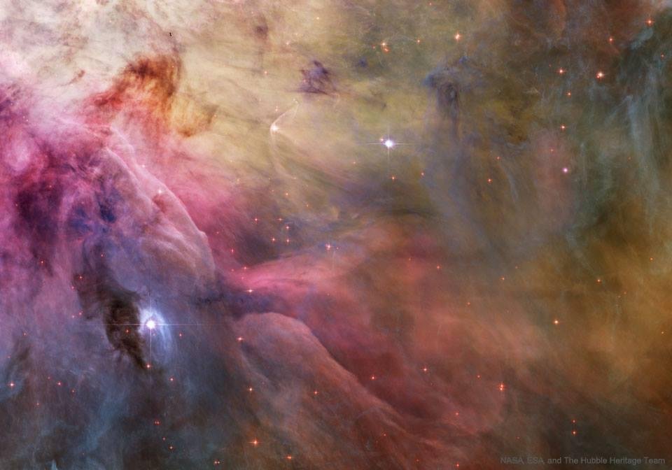 LL Ori and the Orion Nebula
Image Credit: NASA, ESA, and The Hubble Heritage Team
Explanation: Stars can make waves in the Orion Nebula's sea of gas and dust. This esthetic close-up of cosmic clouds and stellar winds featu