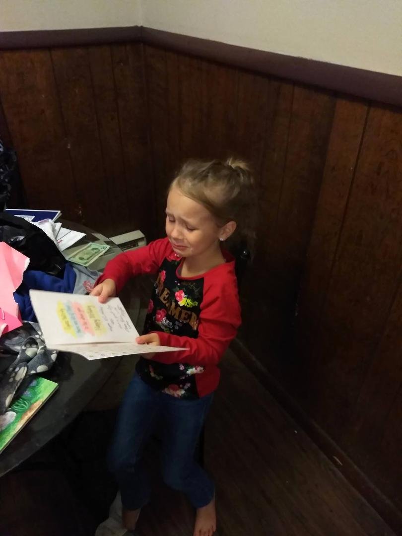 Aspyn reading a birthday card her papa sent her.  I so miss her and her family.  Brought the rain to my eyes.   Love you ABS
