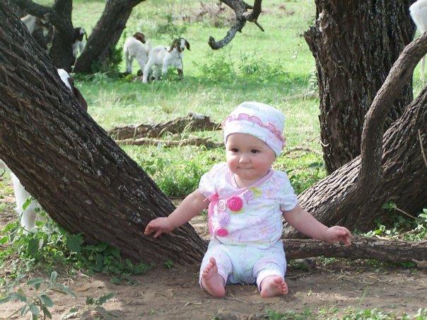 Beatrix Ratliff with baby goats.