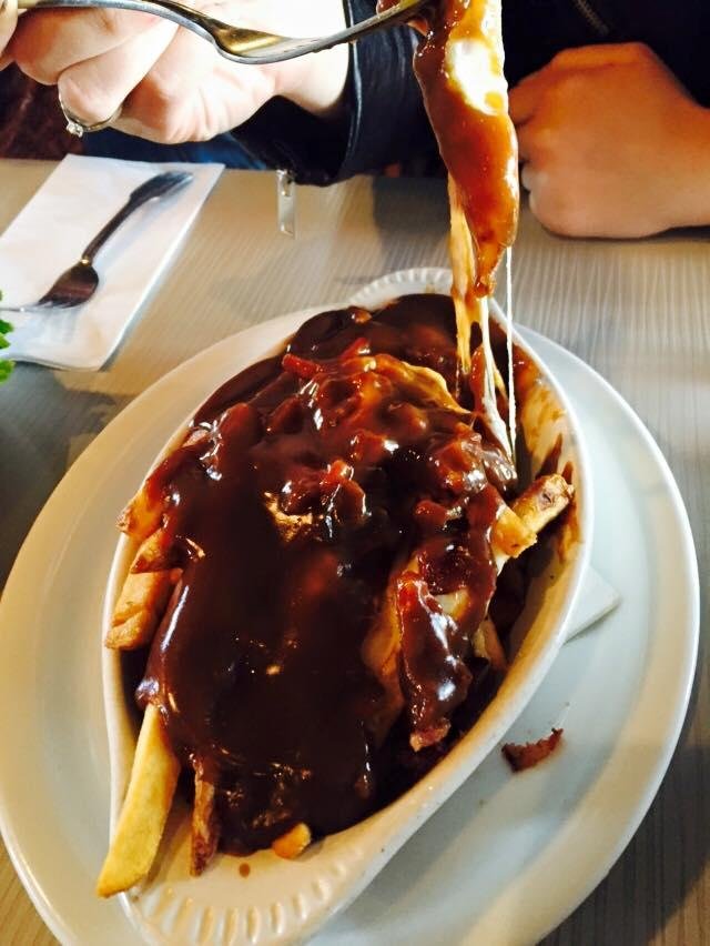 With Gina Wright, Nicole Wright, and Jackie Wright. Aaaahhhh- poutine. Where French Canadian meets the south. Fries, cheese and gravy. Grossly delicious.